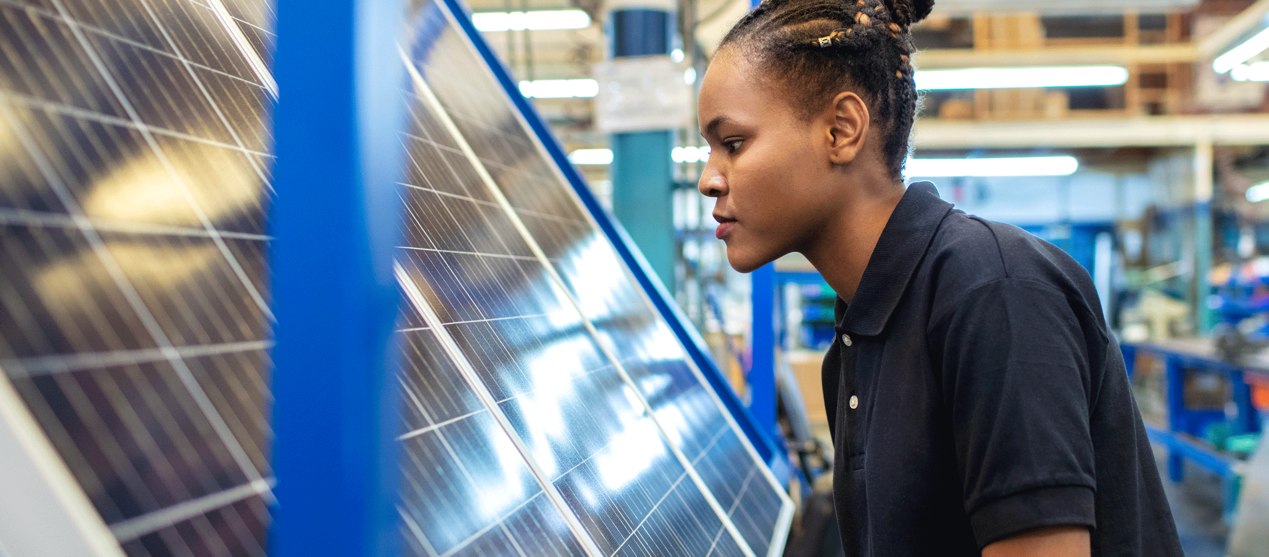 Person inspecting solar panels